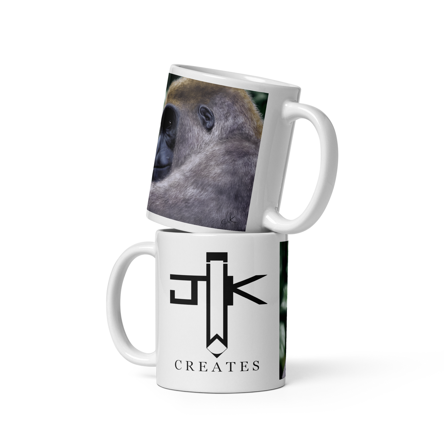 This is a printed mug of a revised digital painting where I started over from scratch. The result is a more realistic gorilla with a pensive gaze. Their human-like qualities make me feel lots of empathy and wonder toward them. They are fascinatingly smart while also full of strength. These apes have long facial hair and powerful jaws along with cute and sympathetic eyes. This digital wildlife animal painting print design is printed on a glossy mug perfect for enjoying your favorite beverages.